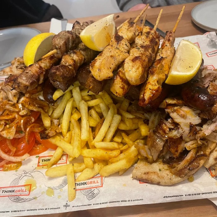Artisan Greek Kitchen Kebabs with pitta bread and potato fries in Livingston